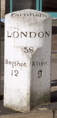 White distance stone showing distance to London, Bagshot and Alton.