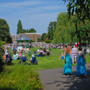 people sitting in park, bandstand