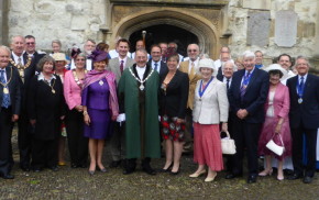 Group of males and females outside church.