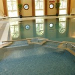 Swimming pool, with large windows in background