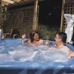 Male and Female in blue hot tub