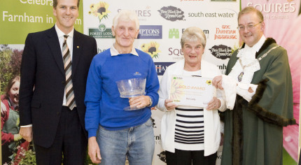 Male and female receive award from Mayor