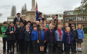 School children, standard bearer, war memorial, Armistice Day 2014.