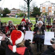 The Farnham Brass Band playing in the bandstand in Gostrey Meadow.