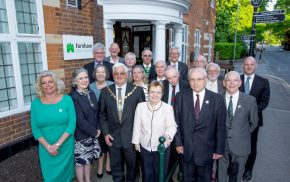 Mayor and group of people standing outside Town Council office.