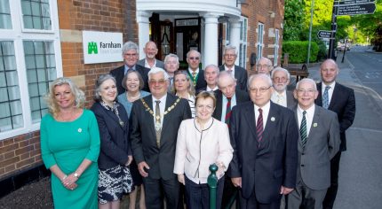 Mayor and group of people standing outside Town Council office.