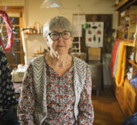 Female is a studio surrounded by knitting and wool